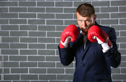 Businessman in boxing glove...