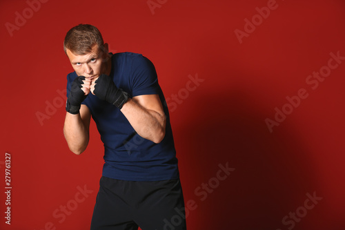 Strong male boxer on color ...