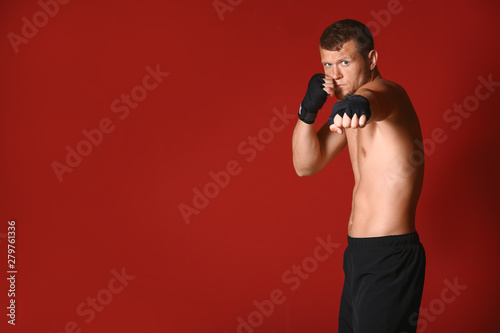 Strong male boxer on color ...