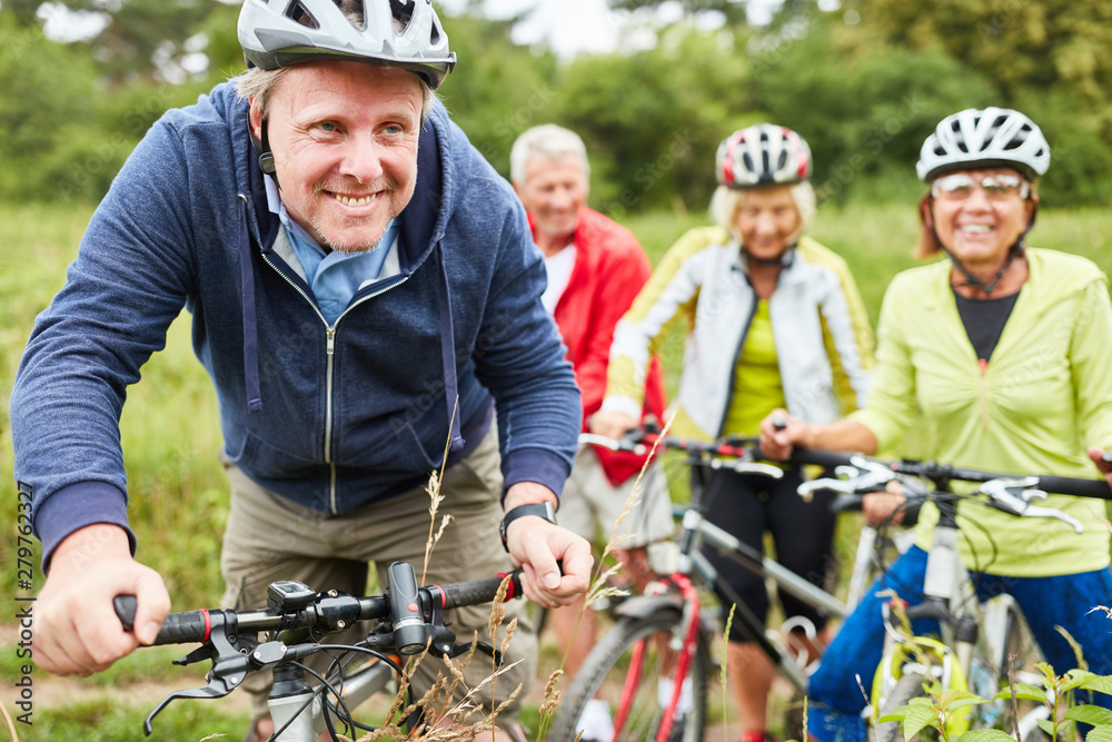 Athletic group seniors while cycling Stock Photo | Adobe Stock