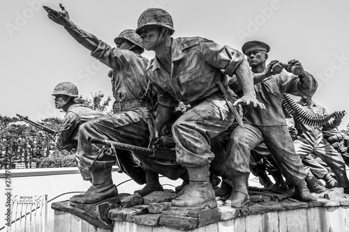 Monument with fighting Soldiers Company for peaceful reunification in War Memorial of Korea. Yongsan, Seoul, South Korea, Asia. photo