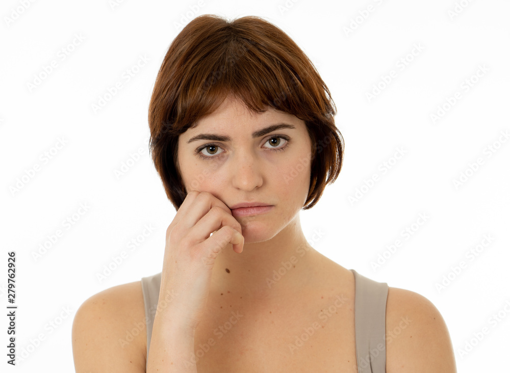 Portrait of sad and serious woman. Isolated in white background. Human expressions and emotions Portrait of sad and serious woman. Isolated in white background. Human expressions and emotions