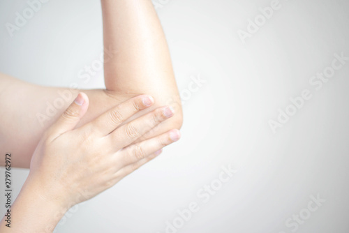 A woman using a hand rub creams