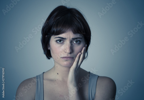 Portrait of sad and depressed woman feeling upset. Human expressions and negative emotions
