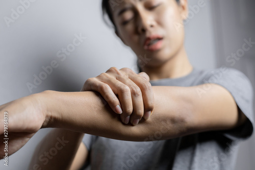 Woman suffering from pain in arm.