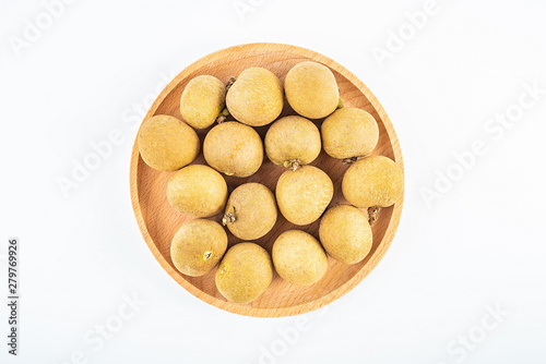 Fresh fruit longan on a plate on white background