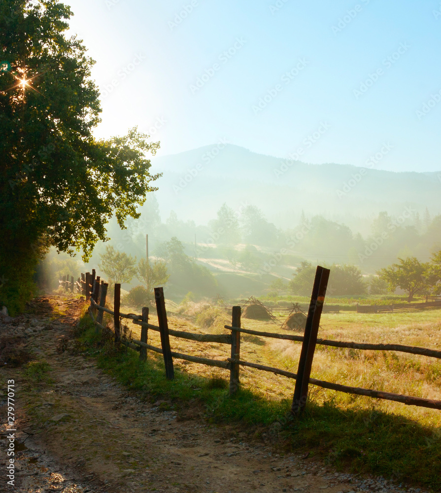 Country road in the early morning in the Carpathians. Tatariv, Ukraine. Country road in the early morning in the Carpathians. Tatariv, Ukraine.