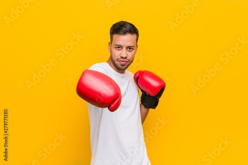 young filipino man boxing with red gloves © Asier