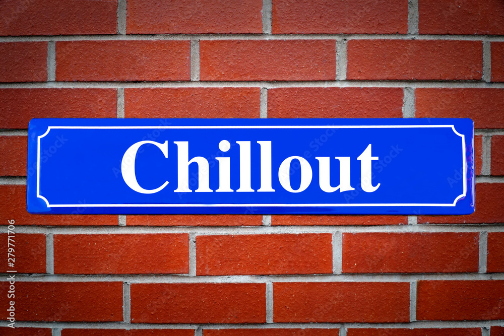 Chillout street sign on brick wall