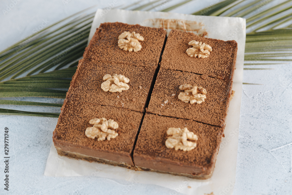 Fototapeta premium Vegan sweet potato brownie on white table. Healthy vegan food concept.