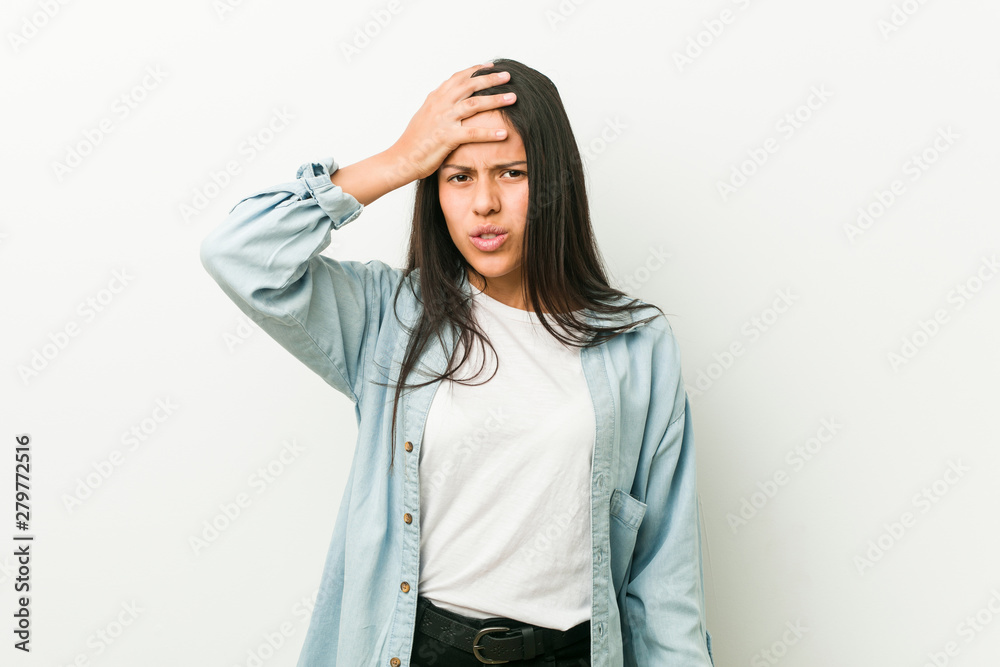 Young hispanic woman tired and very sleepy keeping hand on head. Young hispanic woman tired and very sleepy keeping hand on head.
