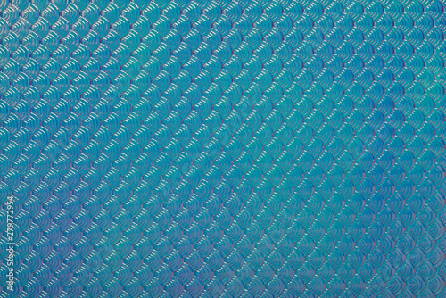 Holographic mermaid fish scales iridescent faux leather texture abstract background.