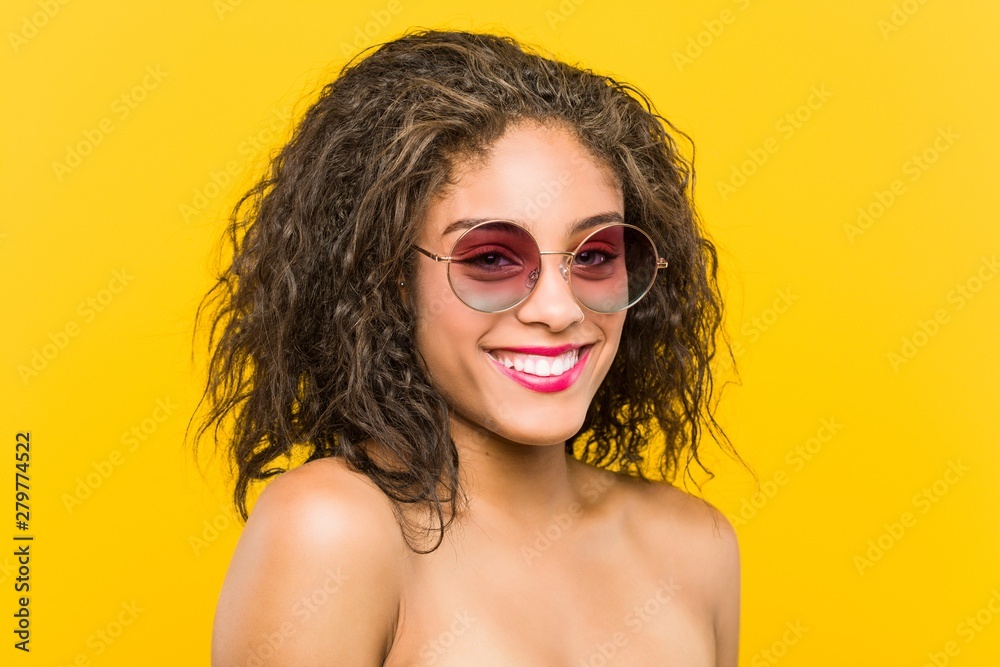 Close up of a young african american beautiful and make-up woman wearing sunglasses Close up of a young african american beautiful and make-up woman wearing sunglasses