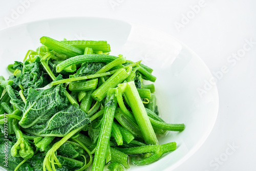 Chinese dish of fried pumpkin vine on white background