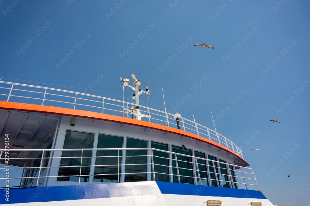 Naklejka premium Ferry on the sea transports cars and travelers