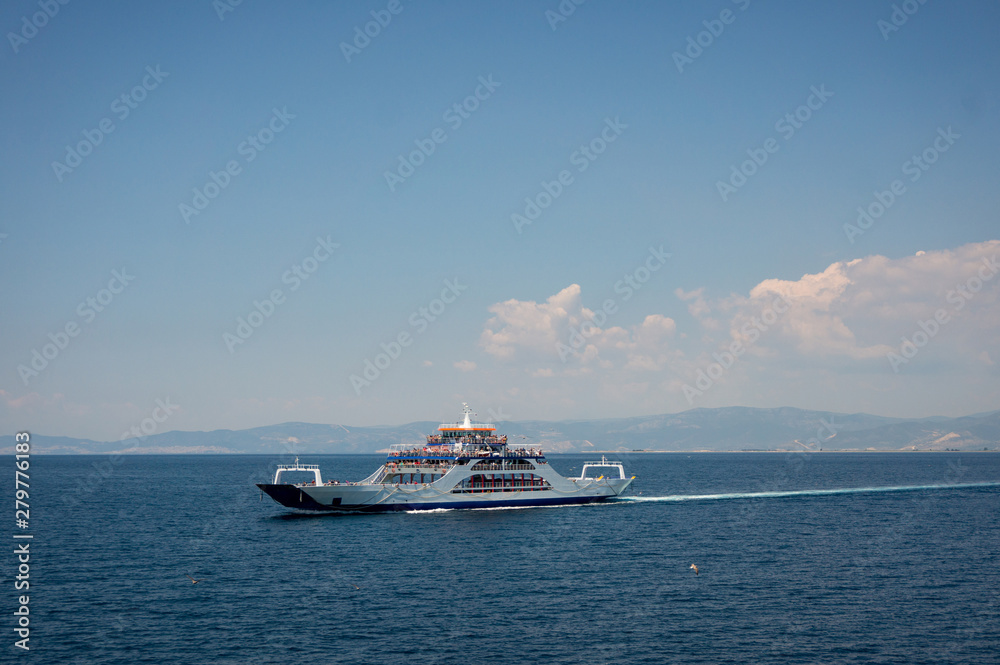 Ferry on the sea transports cars and travelers