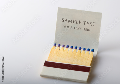 Open matchbox book full of matches