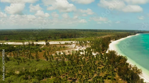 Helipad among the palm trees on a tropical island top view. Helicopter landing site. Bugsuk island, Balabac, Palawan photo