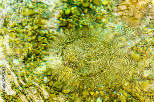 Circles on the surface of the reservoir as a background