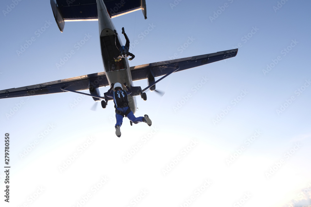 Skydiving. Two skydivers are jumping out of a plane.