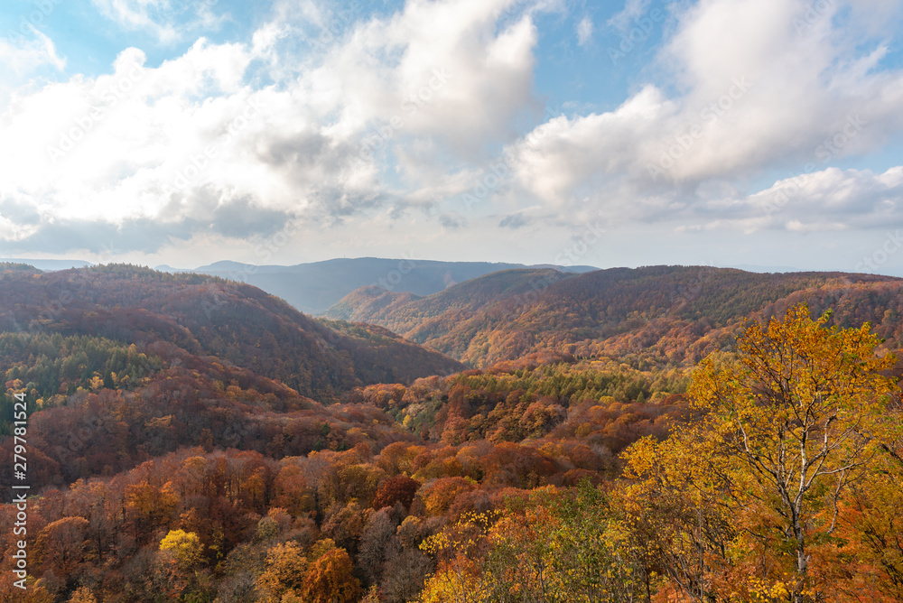 Autumn foliage scenery view, beautiful landscapes. Fall is full of magnificent colours. Entire mountain and valley is bathed in different hues of red, orange and golden colors background Autumn foliage scenery view, beautiful landscapes. Fall is full of magnificent colours. Entire mountain and valley is bathed in different hues of red, orange and golden colors background