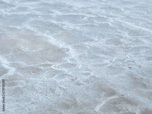 sea water prepared in the salt field to let it dry from sun and become white sea salt in the field of Samut Songkram, Thailand, Fleur de Sel in Sea salt fields, salt-pond, salt-farm
