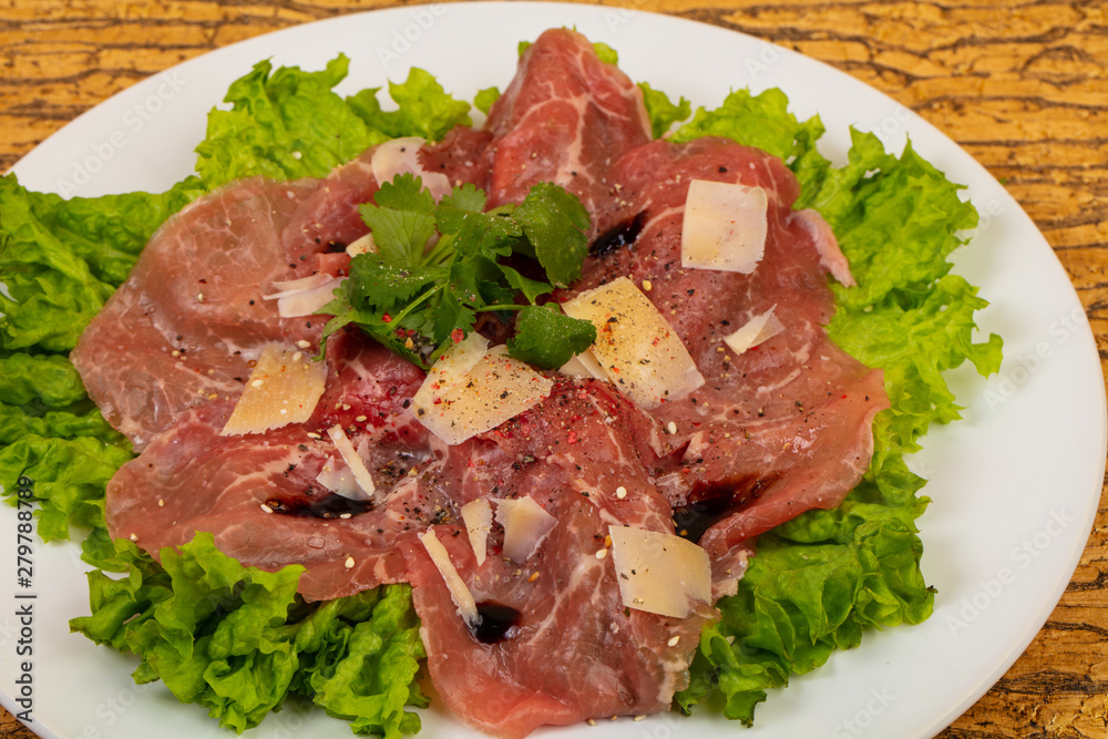 Beef carpaccio with parmesan cheese Beef carpaccio with parmesan cheese