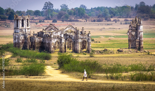 Abandoned church in Hassan, India. Middle of no where. Lonely old man walking in a remote village in India