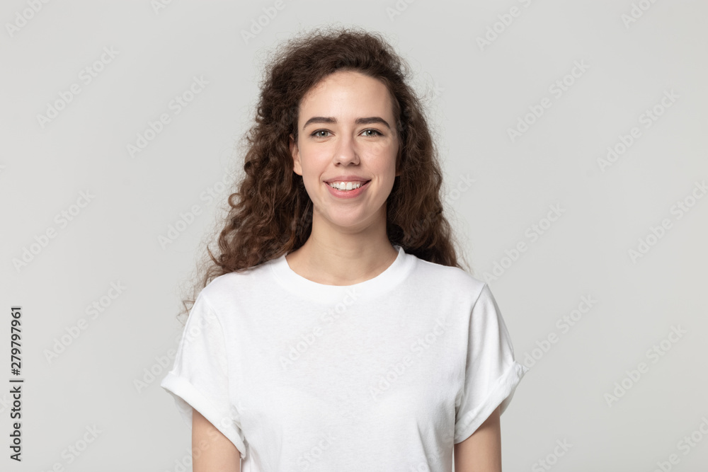 Smiling young woman looking at camera studio shot Smiling young woman looking at camera studio shot