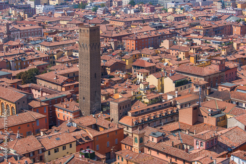Panoramic view of the tiled roofs and Torre Prendiparte in the city of Bologna Italy photo