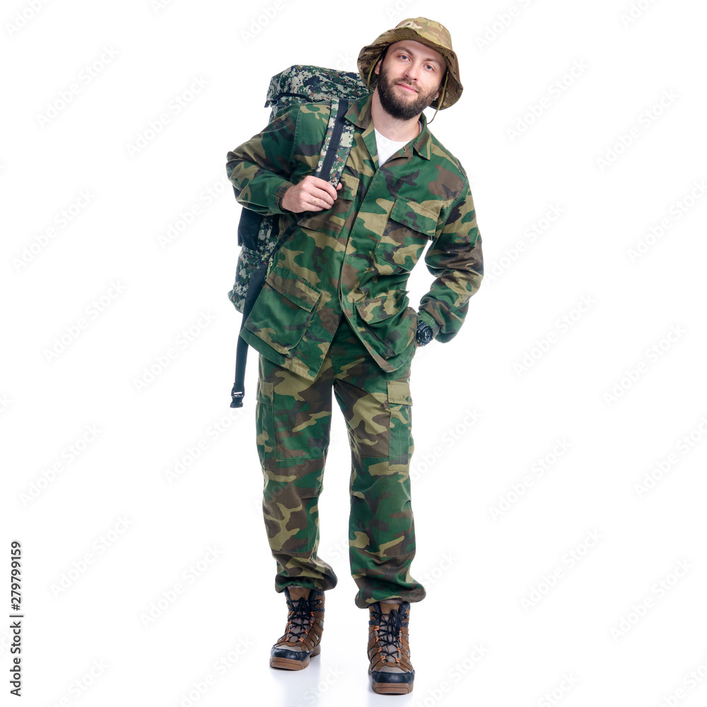 Man in camouflage clothes with backpack hiking standing looking on white background isolation Man in camouflage clothes with backpack hiking standing looking on white background isolation