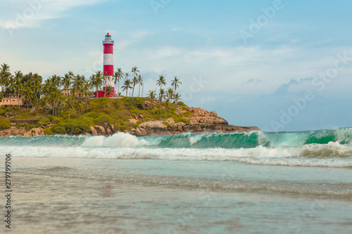  Lighthouse beach at Trivandrum, India. Blue hues and Travel photo. . Holiday in Beautiful Kerala. Coastline of Kovalam.