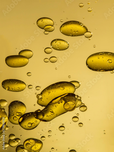 golden yellow bubble oil droplet, abstract background