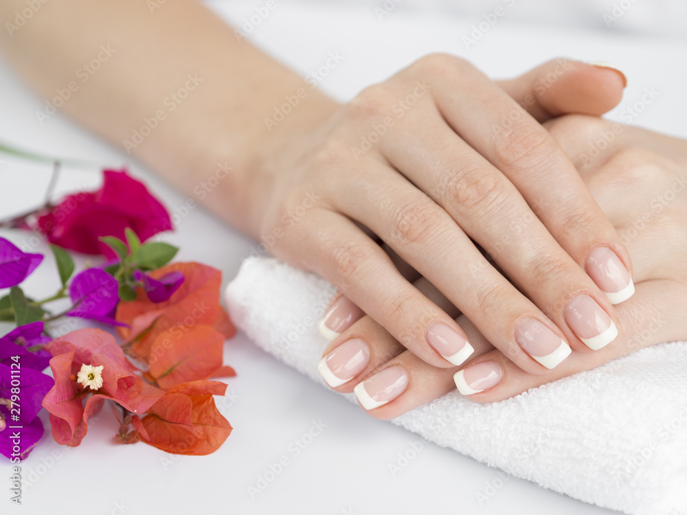 Delicate woman hands with manicured fingernails