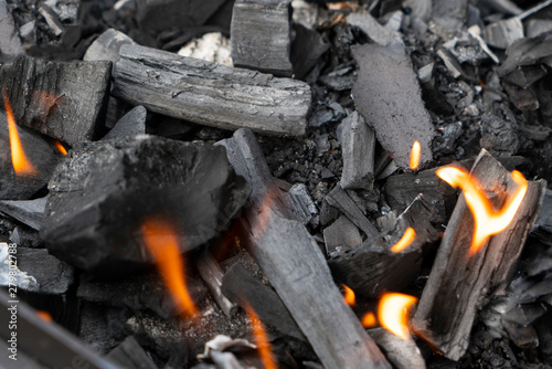 texture, charcoal for fire close-up, Bonfire camping picnic coals close up red,