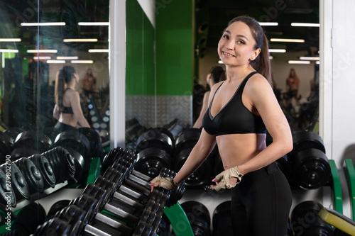 Pretty young sport woman is Workout in gym, Healthy lifestyle