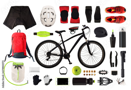 Flat lay of bicycle equipment and accessories isolated on white background. Top view of bike clothes and gear