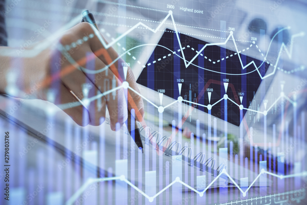 Financial forex graph drawn over hands taking notes background. Concept of research. Multi exposure Financial forex graph drawn over hands taking notes background. Concept of research. Multi exposure