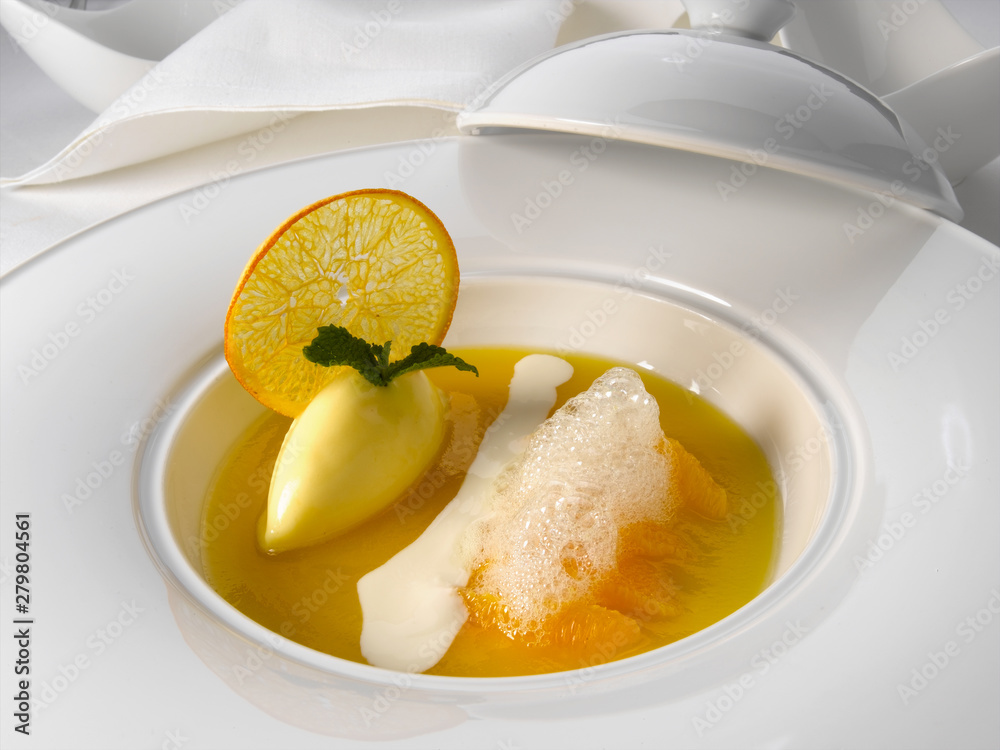 postre gourmet de mandarina con helado de limón. mandarin gourmet dessert with lemon ice cream. postre gourmet de mandarina con helado de limón. mandarin gourmet dessert with lemon ice cream.