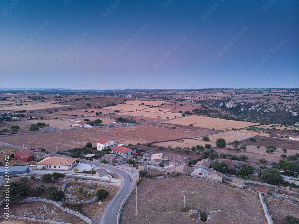 Aerial view of a rural field in Sicily at early sunrise