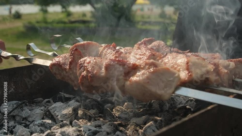 Young man preparing barbecue on nature.Outdoor recreation.Grilling, on the nature