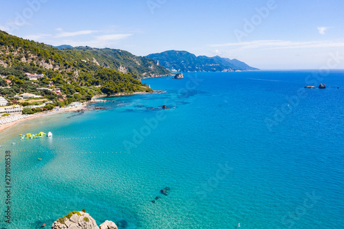 Aerial view of the ocean and beautiful rocks and islands. Summer background of beach, stones seen from above.