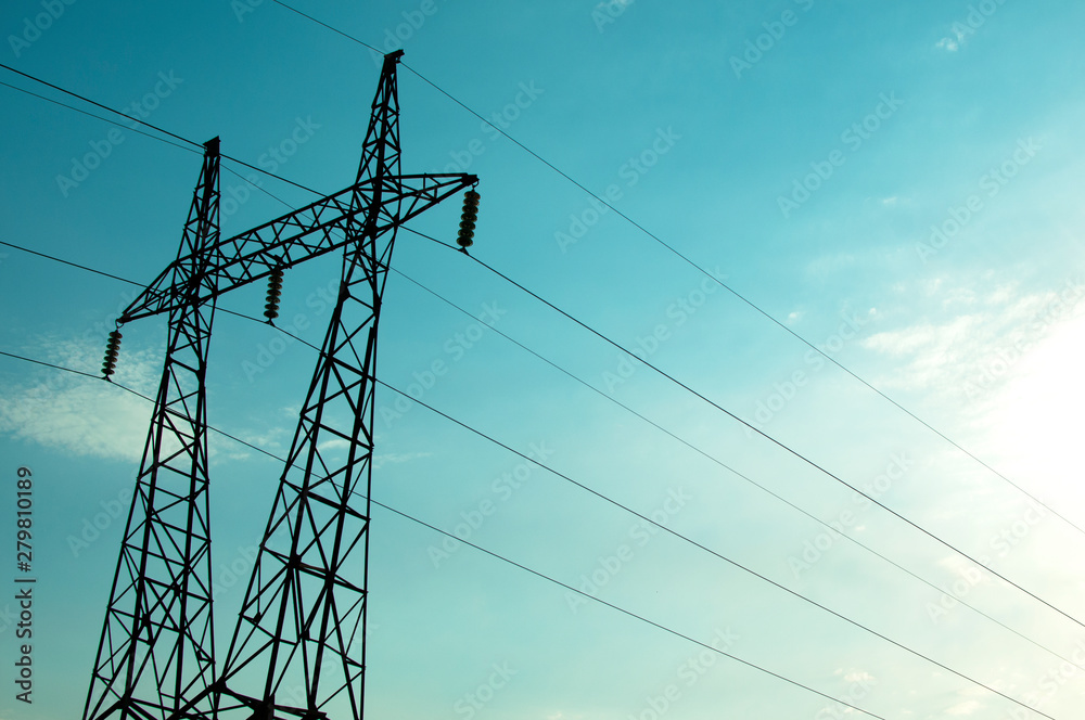 Electricity line pole at sunset. Electricity pylon.