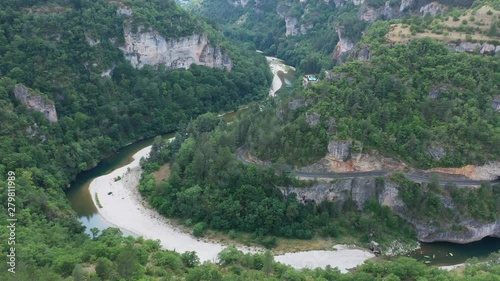 Tarn river with a winding road in a canyon pine forest France aerial gorges du Tarn photo