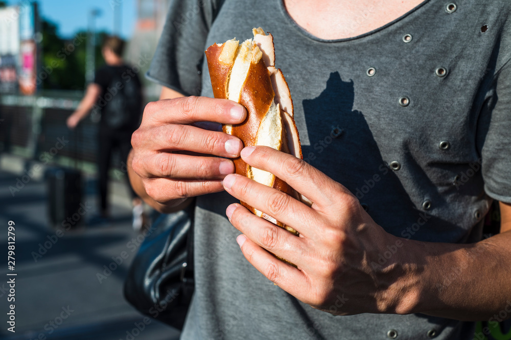 man eating a german ham sandwich man eating a german ham sandwich