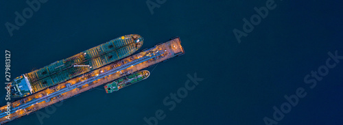 Bild auf Leinwand Aerial view tanker ship loading in port at night, Tanker ship logistic import export business and transportation, Business commercial power and energy cargo vessel boat ship with copy space