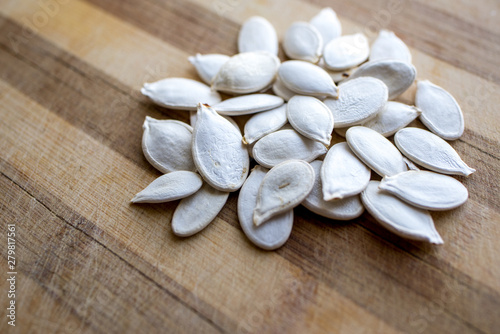 sunflower seeds on wooden background