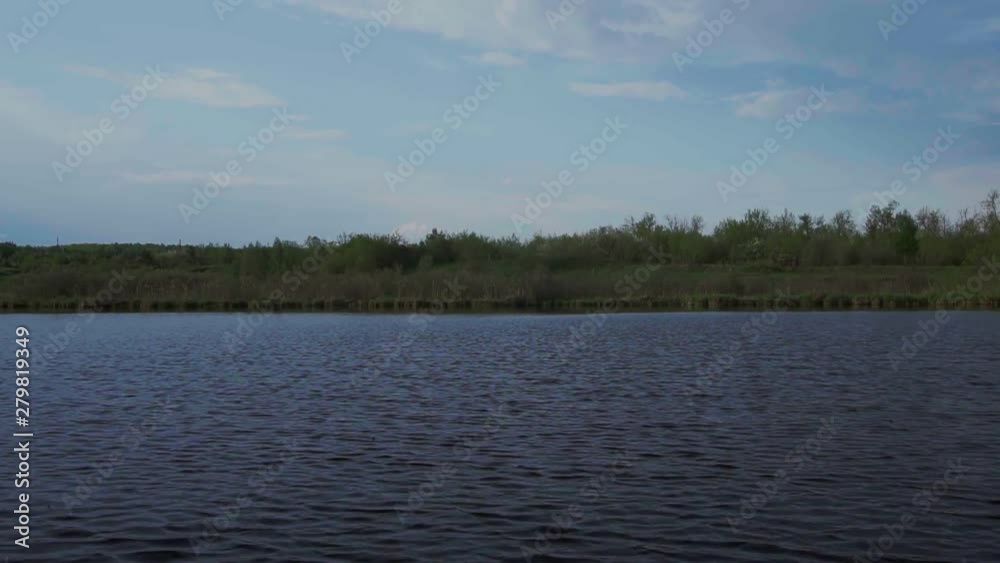 Calm River Surface Shimmers Against The Background Of The Forest Calm River Surface Shimmers Against The Background Of The Forest