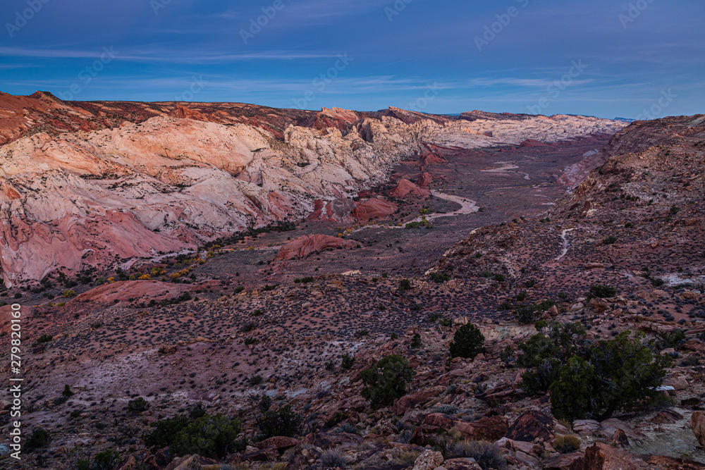 Panorama view of the east side of waterpocket fold from Halls Creek Overlook of Capitol Reef National Park, Utah USA at dawn.
