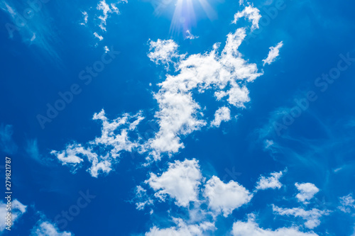 blue sky background with big tiny clouds